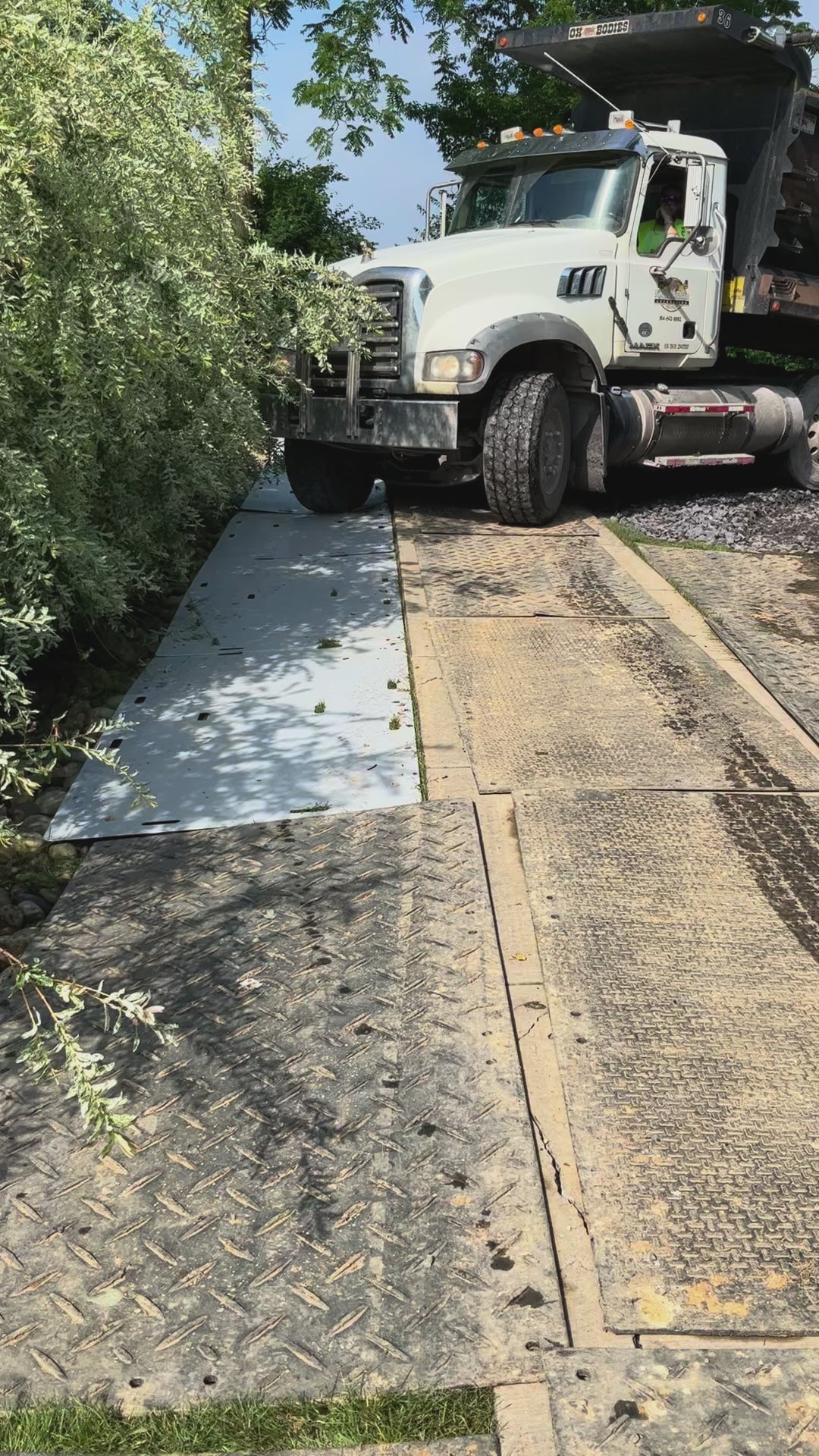 Load video: Watch the demo of our mats as a tri-axel, Avant, and other equipment rolls over them with no issues.